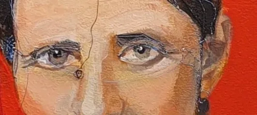 Zoomed detail of the portrait's eyes, with free-motion thread lines crossing the painted face